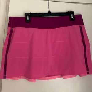 12 Tall. Pink and purple Lululemon tennis skirt.